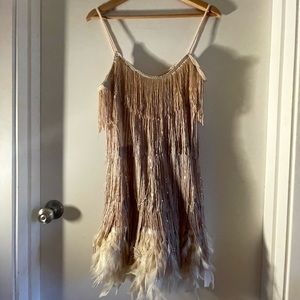 Champagne sparkley tassel ball-drop dress with feathers.